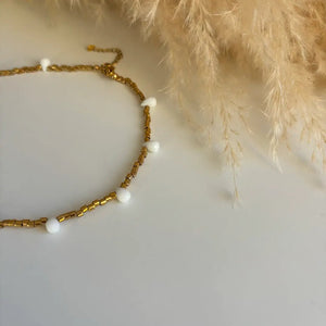 FIDUCIA – Collana dorata con gocce di cristallo - OE!