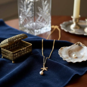 ASTEROIDEA - collana con ciondolo stella marina in zirconi e perla - OE!