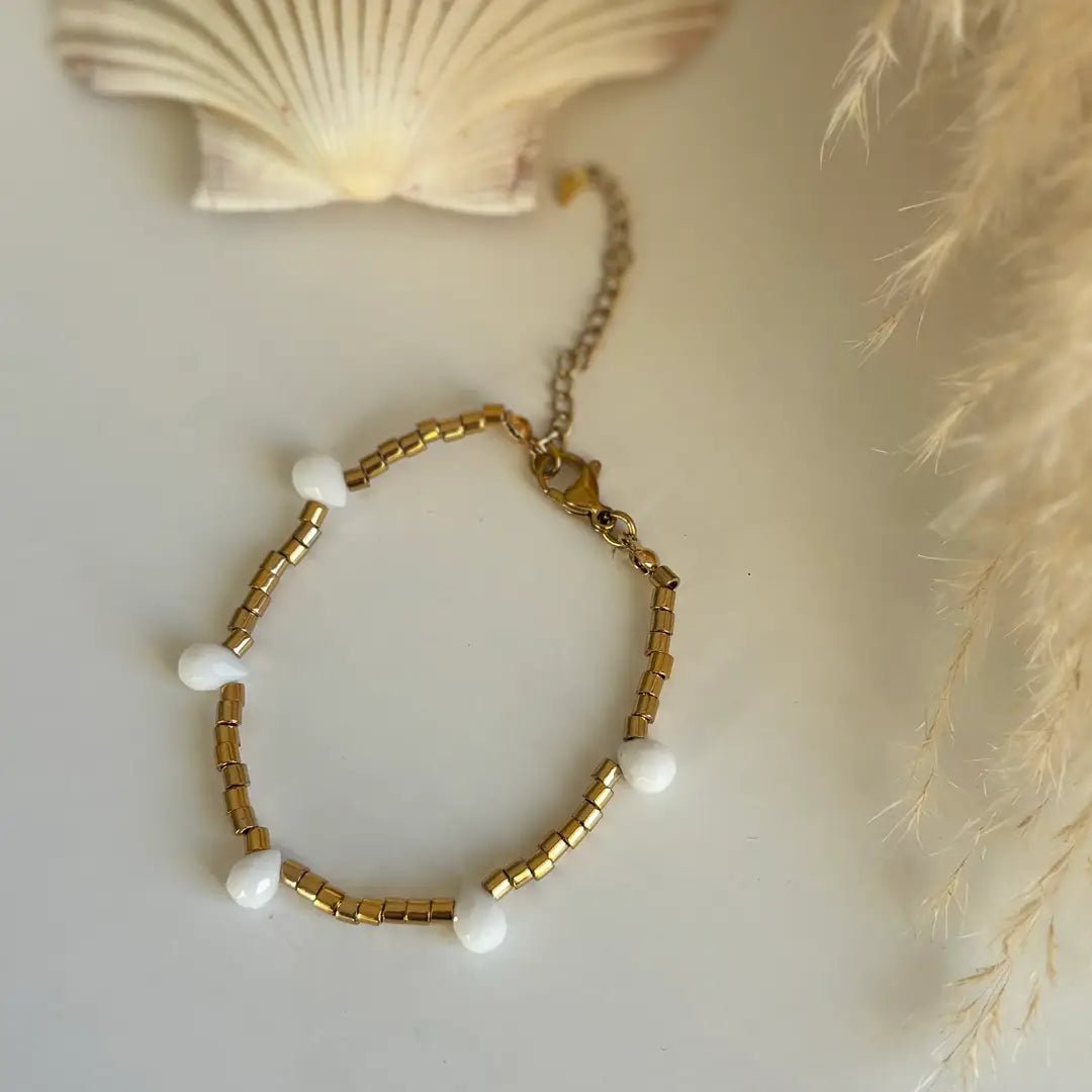 FIDUCIA – Bracciale dorato con gocce di cristallo - OE!