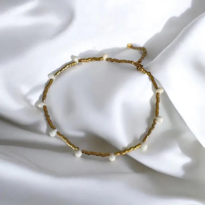 FIDUCIA – Collana dorata con gocce di cristallo - OE!