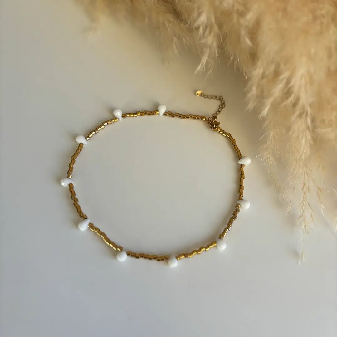 FIDUCIA – Collana dorata con gocce di cristallo - OE!