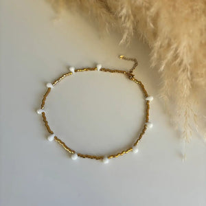 FIDUCIA – Collana dorata con gocce di cristallo - OE!