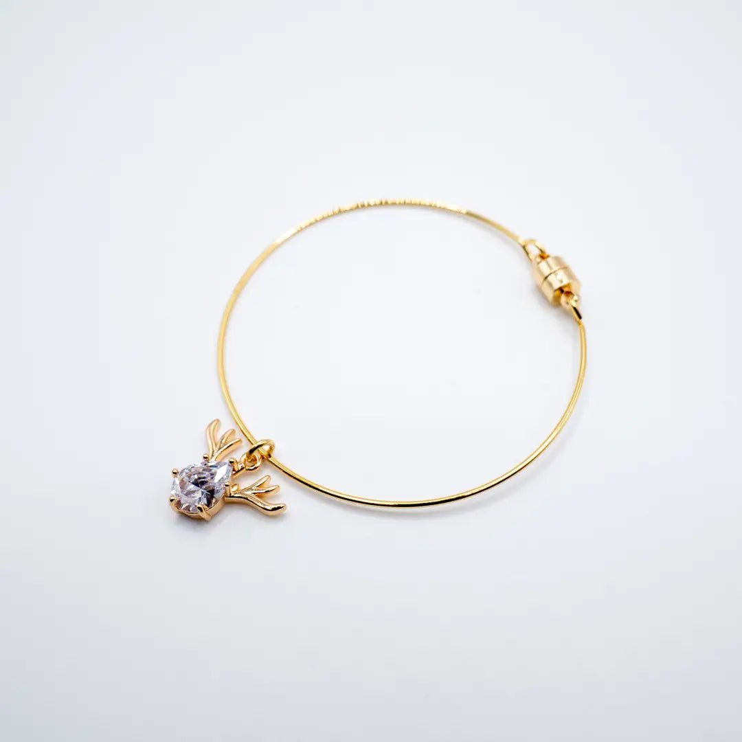 Reindeer - bracciale rigido dorato con ciondolo in cristallo - OE!